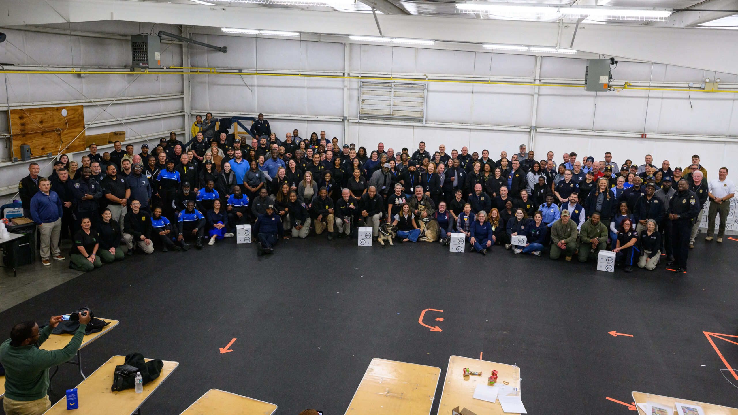 Carolinas Officers Unite to Pack 2,000 Greg’s Groceries Boxes